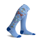 A pair of light blue knee-high socks adorned with colorful butterflies, ladybugs, and floral accents. 