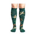 Close-up of a person's legs wearing the Flying Cranes knee-high socks; showcasing the full design on the legs.