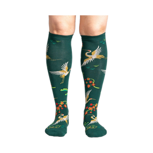 Close-up of a person's legs wearing the Flying Cranes knee-high socks; showcasing the full design on the legs.