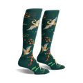 Pair of women's knee-high socks in hunter green. Features gold cranes, red blossoms, and green foliage.