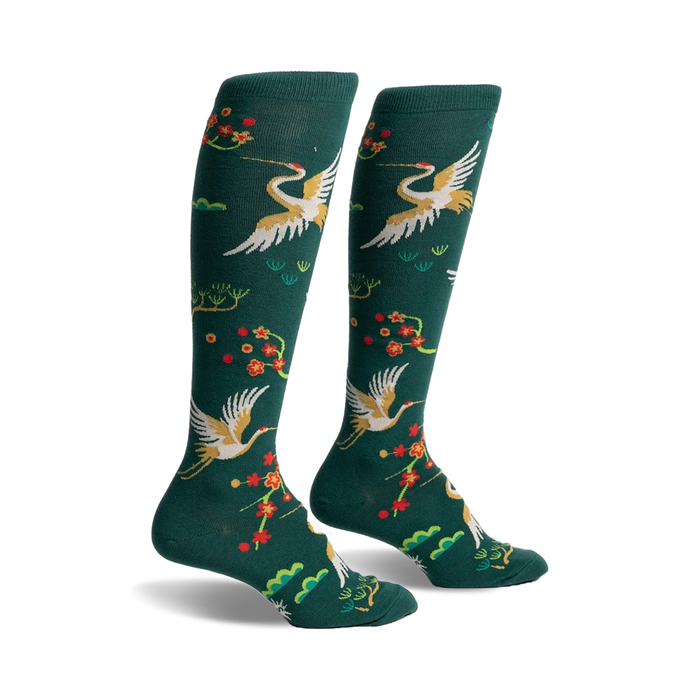 dark green knee-high women's socks with a vibrant pattern of red, orange, white, and yellow cranes and flowers.   