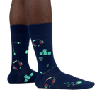 Lifestyle shot of the socks glowing in the dark, highlighting the luminescent design elements.