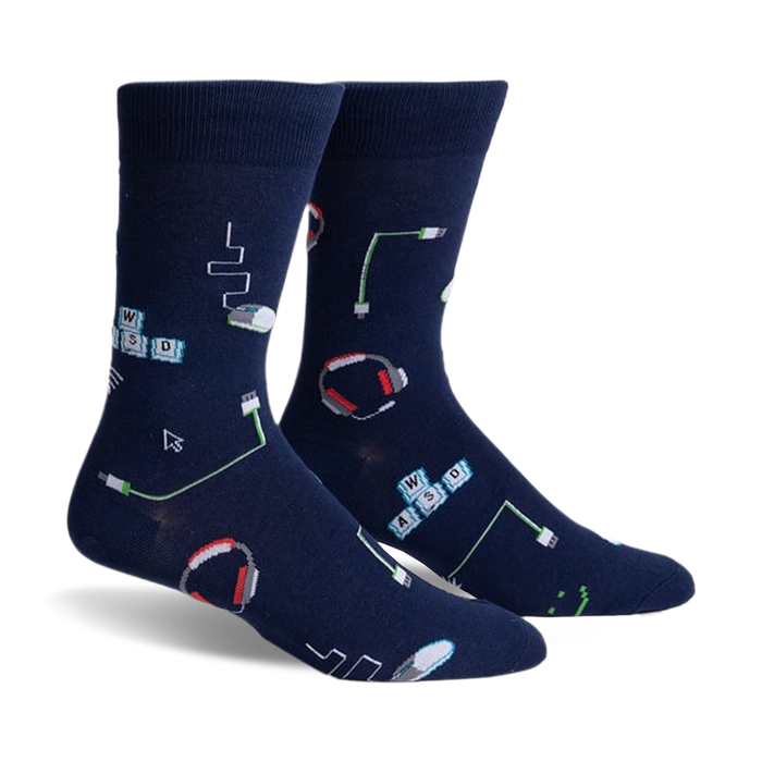 front view of a pair of blue socks with gaming themed graphics. the graphics include: computer keyboard keys, computer mouse, headset, and cords.