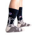 Lifestyle shot of a person's legs wearing the 'High-est 5' socks against a black background.