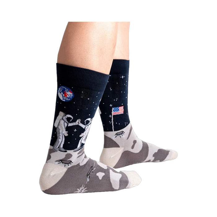 Lifestyle shot of a person's legs wearing the 'High-est 5' socks against a black background.