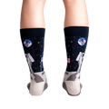 Rear view of a person wearing the 'High-est 5' socks, showcasing the full design on both socks.