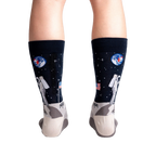 Rear view of a person wearing the 'High-est 5' socks, showcasing the full design on both socks.