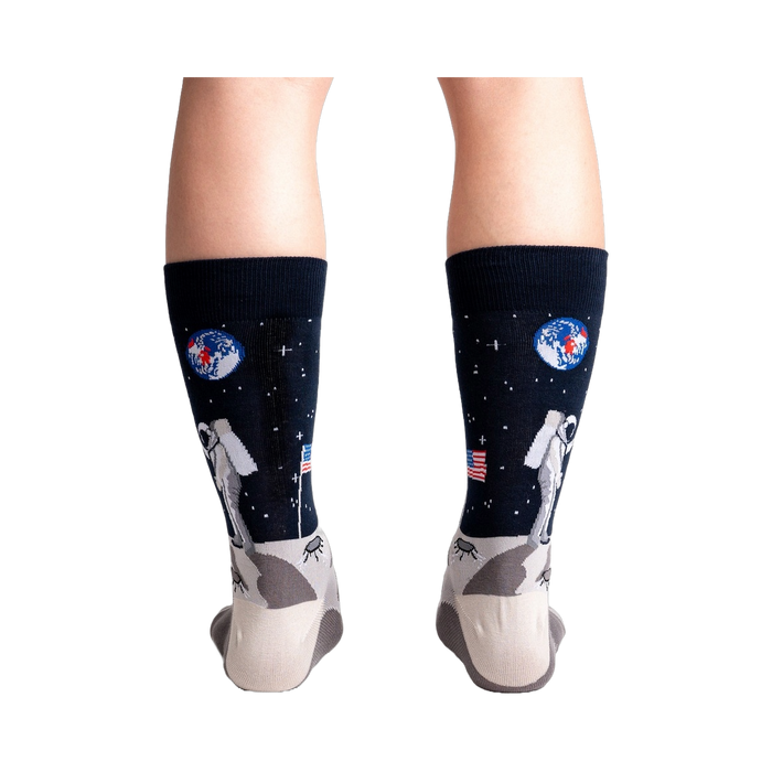Rear view of a person wearing the 'High-est 5' socks, showcasing the full design on both socks.