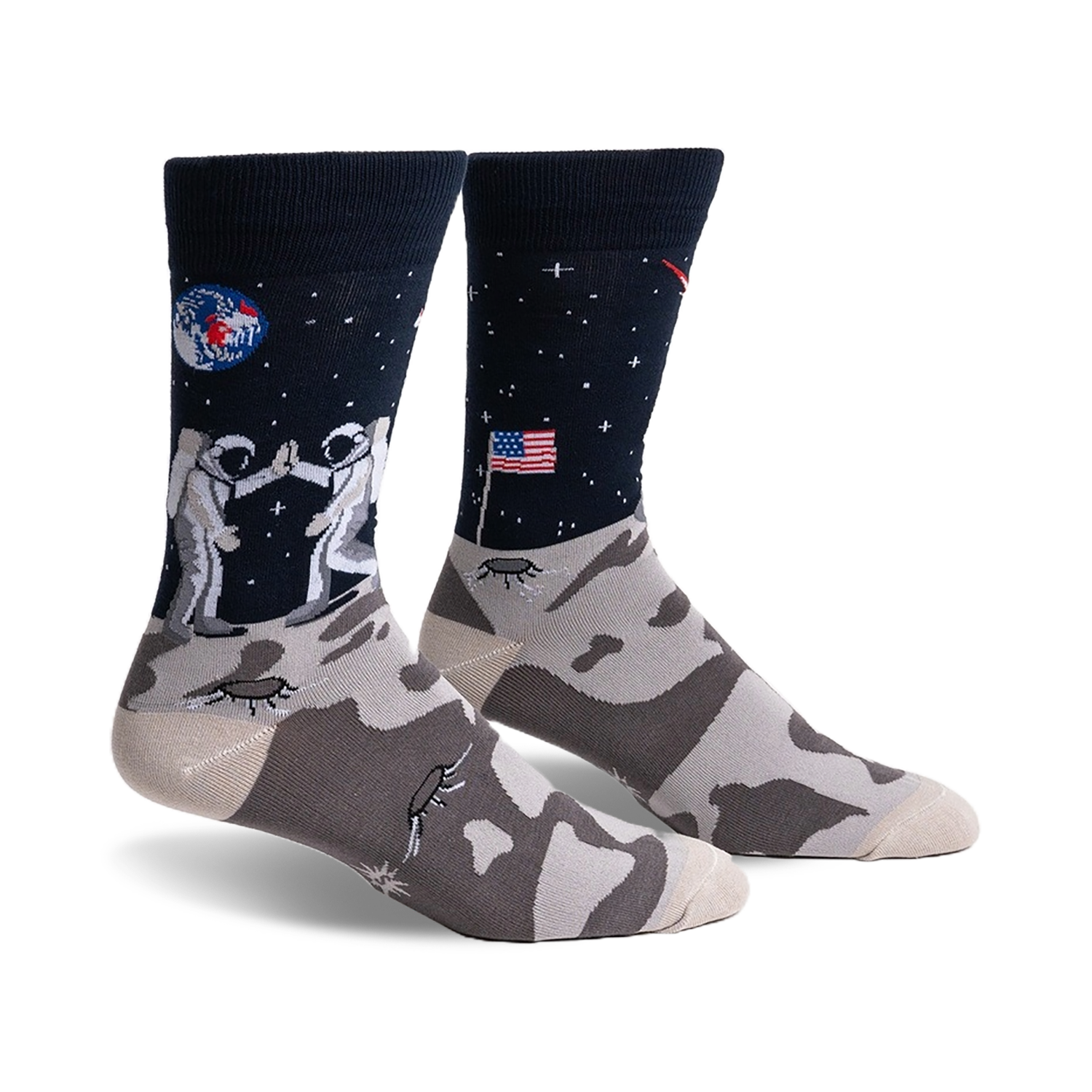 Pair of crew socks; navy blue with astronauts high-fiving on the moon, a US flag, and a lunar landscape. The foot features a grey moon rock pattern.