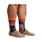 Lifestyle shot: The Sasquatch Scream socks on a model's legs, showcasing the full design and fit.