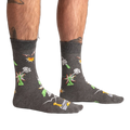 Lifestyle shot of a person wearing the Weird Science socks, showcasing the glow-in-the-dark feature.