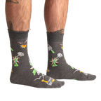 Lifestyle shot of a person wearing the Weird Science socks, showcasing the glow-in-the-dark feature.