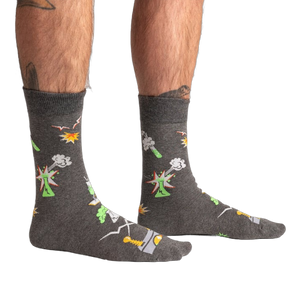 Lifestyle shot of a person wearing the Weird Science socks, showcasing the glow-in-the-dark feature.