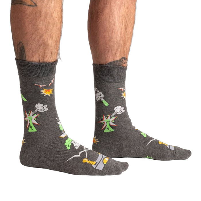 Lifestyle shot of a person wearing the Weird Science socks, showcasing the glow-in-the-dark feature.