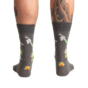 Back view of the Weird Science socks on a model, showing the full design on both socks.