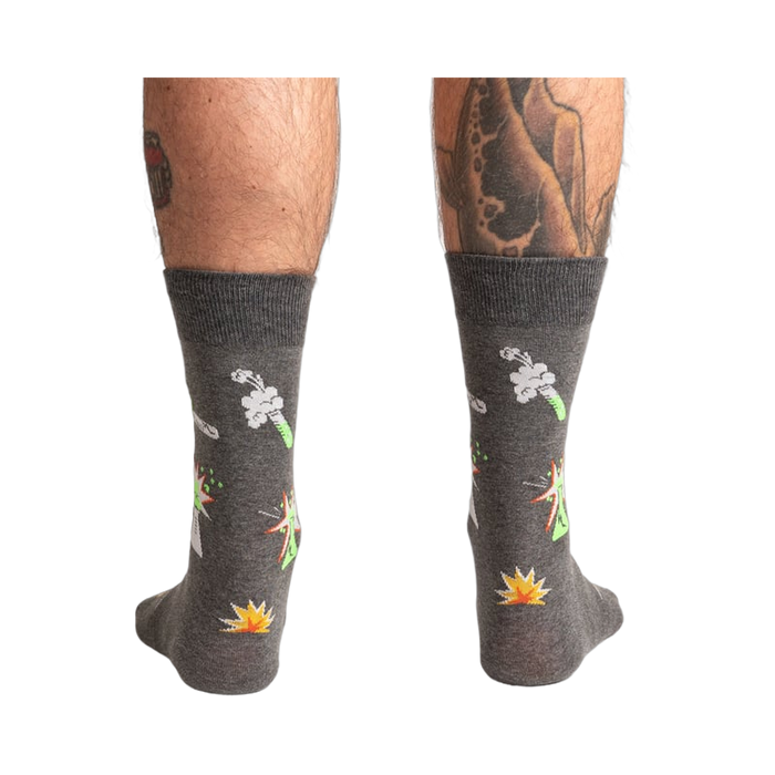 Back view of the Weird Science socks on a model, showing the full design on both socks.