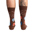 Rear view of a man's legs wearing the brown yo-yo socks.