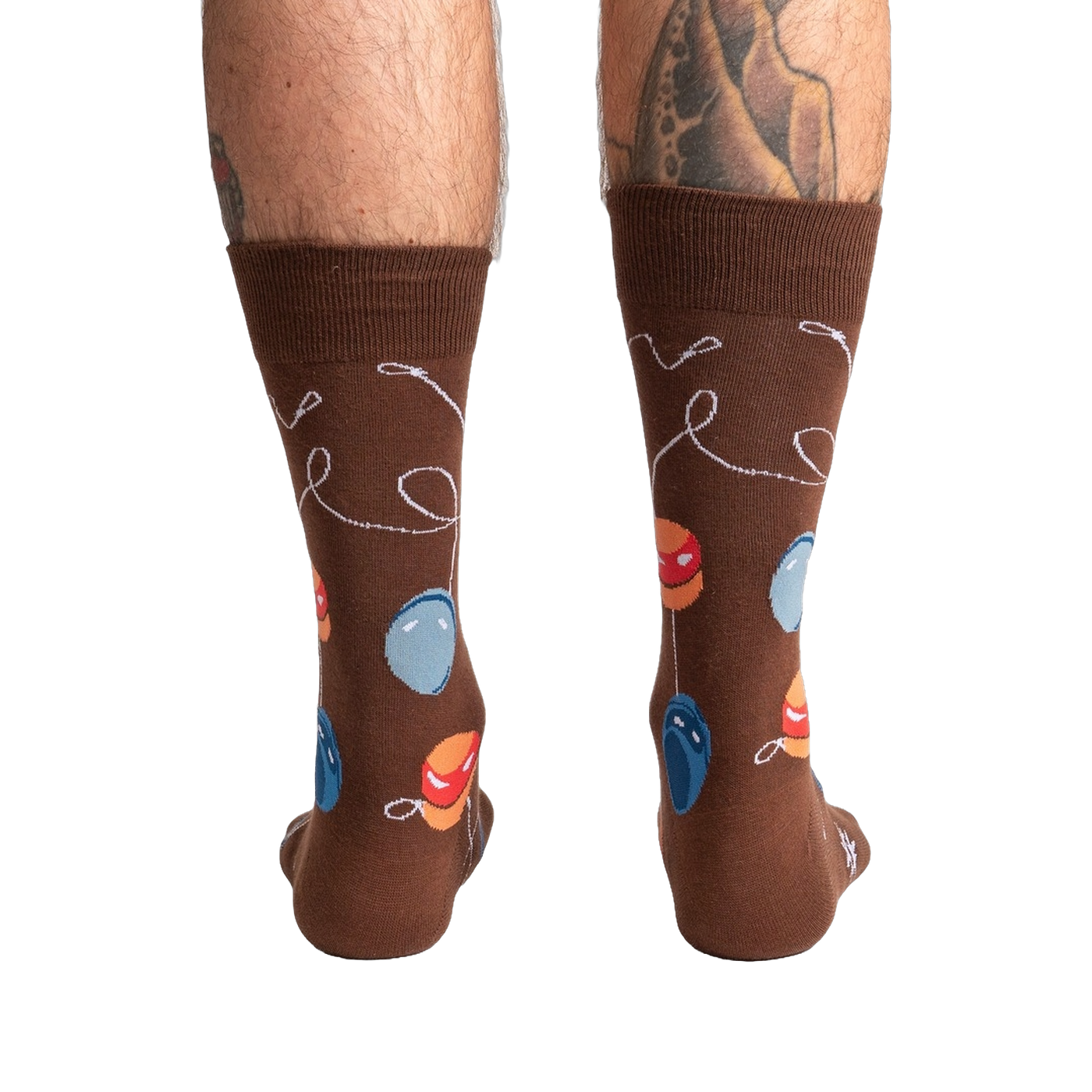 Rear view of a man's legs wearing the brown yo-yo socks.