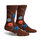 Brown crew socks with a playful design of colorful yo-yos on strings. 