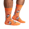 Lifestyle shot of Rad Chicken socks on a person's legs, showing the socks' length and fit.