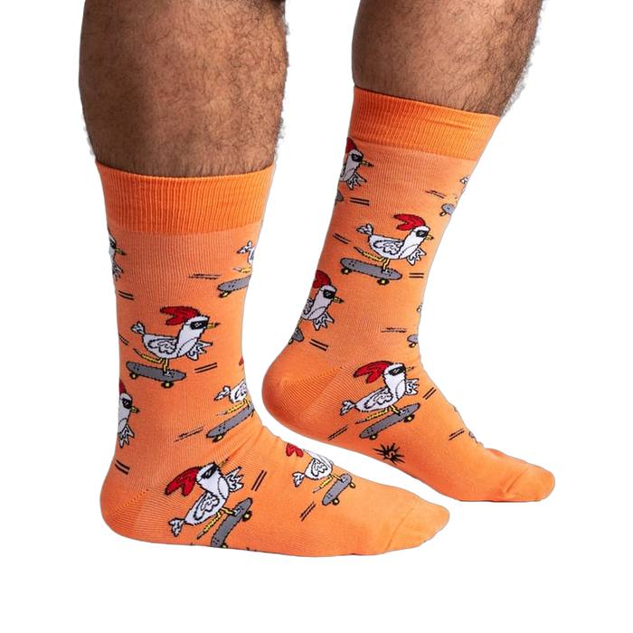 Lifestyle shot of Rad Chicken socks on a person's legs, showing the socks' length and fit.
