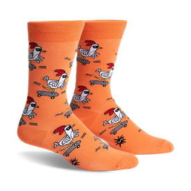 pair of orange socks with a pattern of chickens skateboarding. the socks are shown from the side.