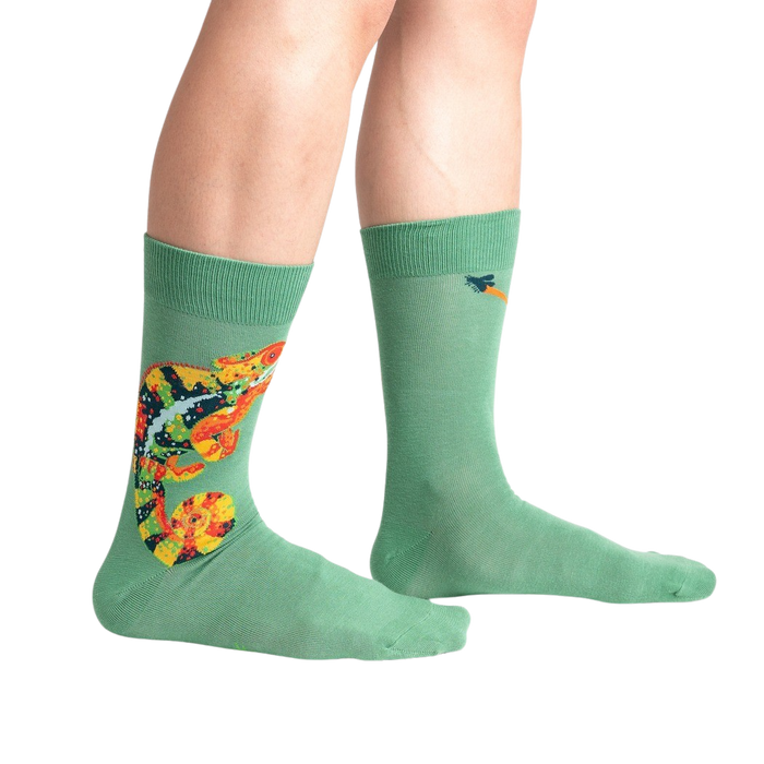 A pair of green socks with a colorful pattern on the back of the calf.
