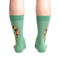 Rear view of a person wearing the socks, highlighting the full chameleon design on the back of the socks.