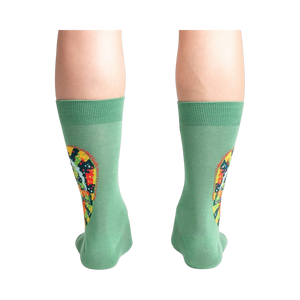 Rear view of a person wearing the socks, highlighting the full chameleon design on the back of the socks.