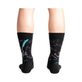 Rear view of a person wearing The Constitution socks, highlighting the quill and ink detail on the back of the socks.