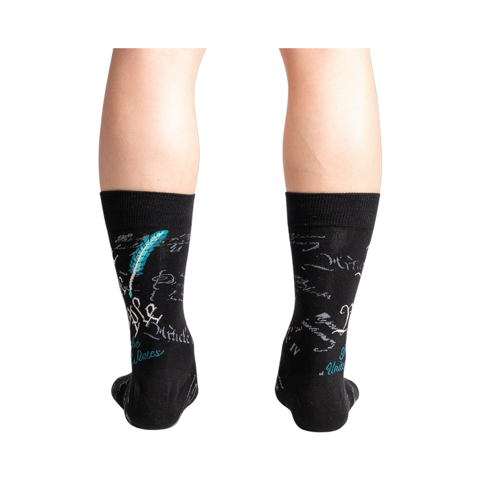 Rear view of a person wearing The Constitution socks, highlighting the quill and ink detail on the back of the socks.