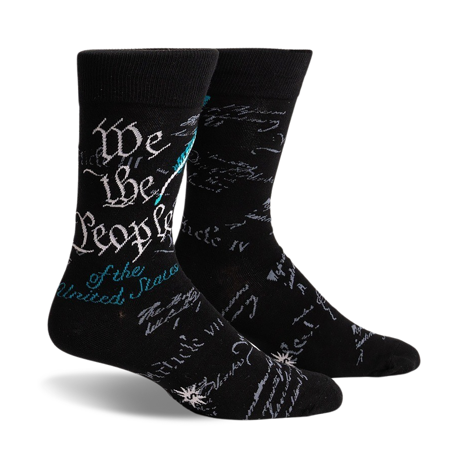 Pair of black crew socks featuring the text of the US Constitution preamble in teal and gray. A quill and ink design is subtly present.