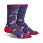 Pair of crew socks in navy blue with red stripes, featuring small American flag graphics and 'EST. 1776' text.