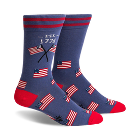 blue crew socks feature pattern of american flags and "est. 1776." toe and heel are red.  