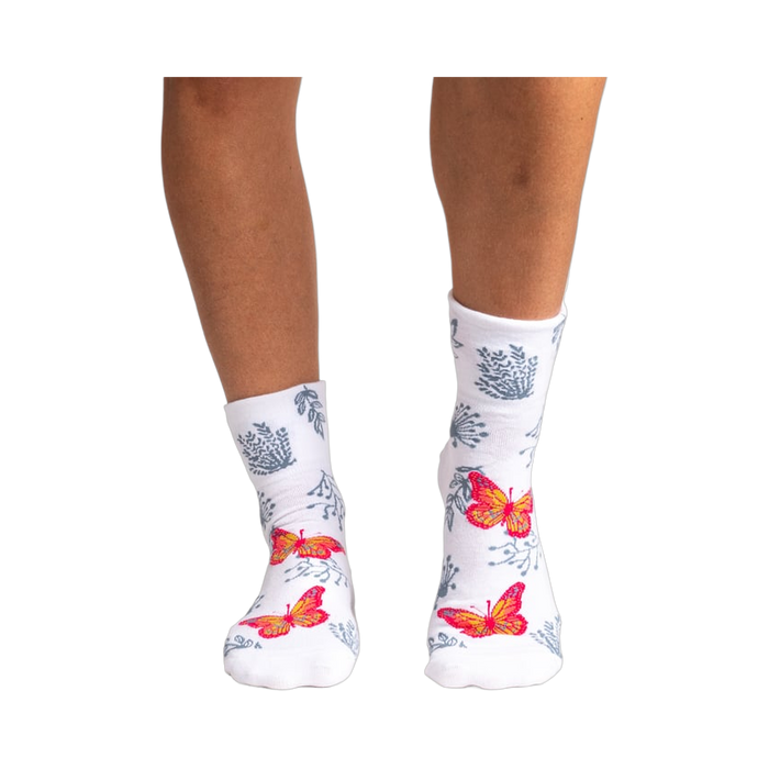 Back view of women's white ankle socks showcasing the butterfly and floral print.
