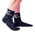 Lifestyle shot showing a person wearing the 'Just A Phase' socks, showcasing how they look on feet.