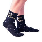 Lifestyle shot showing a person wearing the 'Just A Phase' socks, showcasing how they look on feet.