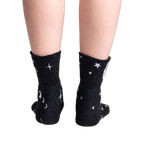 Back view of the socks showing the moon and star pattern.