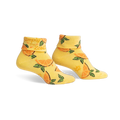Pair of yellow ankle socks with an orange slice pattern and 'Simply the Zest!' text on the cuff.  Fun, bright, and comfy!