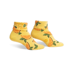 Pair of yellow ankle socks with an orange slice pattern and 'Simply the Zest!' text on the cuff.  Fun, bright, and comfy!