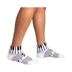 Lifestyle shot showing the socks on a person's legs, highlighting their fit and style.