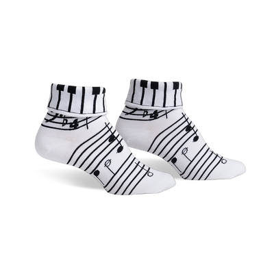 Pair of women's white ankle socks with black musical notes and a piano keyboard cuff design.