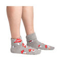 Lifestyle shot showing the socks on a person's legs, showcasing the fit and style of the 'Magical! Turn Cuff' socks.