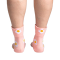 Back view of the socks on a person's legs, highlighting the design on the back of the socks.