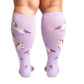 Back view of the socks on a person's legs, showing the full design and fit of the lavender unicorn knee-highs.
