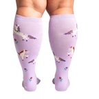 Back view of the socks on a person's legs, showing the full design and fit of the lavender unicorn knee-highs.