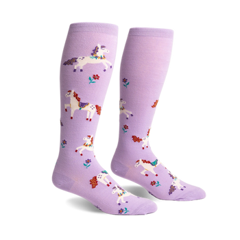 Pair of light purple knee-high socks with a pattern of white horses featuring colorful manes and small flowers.