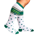 Lifestyle shot showing a person's legs wearing the '100% Lucky' knee-high socks, highlighting their fit and stretch.