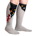 Lifestyle shot of the 'Moon Walk in the Morning' socks on a person's legs, highlighting the extra stretch.