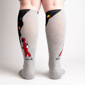 Rear view of the socks showing the full design on both socks. The grey and black space theme is visible.